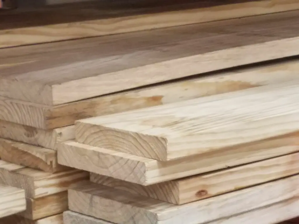 A stack of pine 2x10 lumber. The weight of these 2x10 boards is a little under 3 pounds per foot.