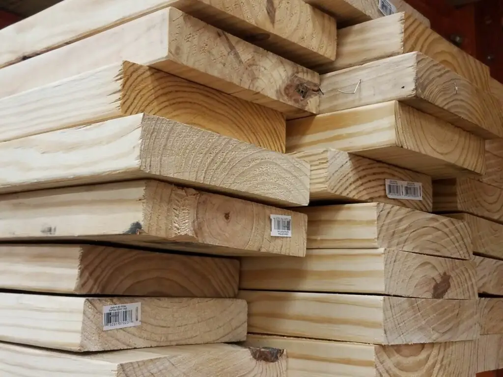 A stack of pine 2x8 lumber. 2x8 weight for these boards is about 2 pounds per foot.