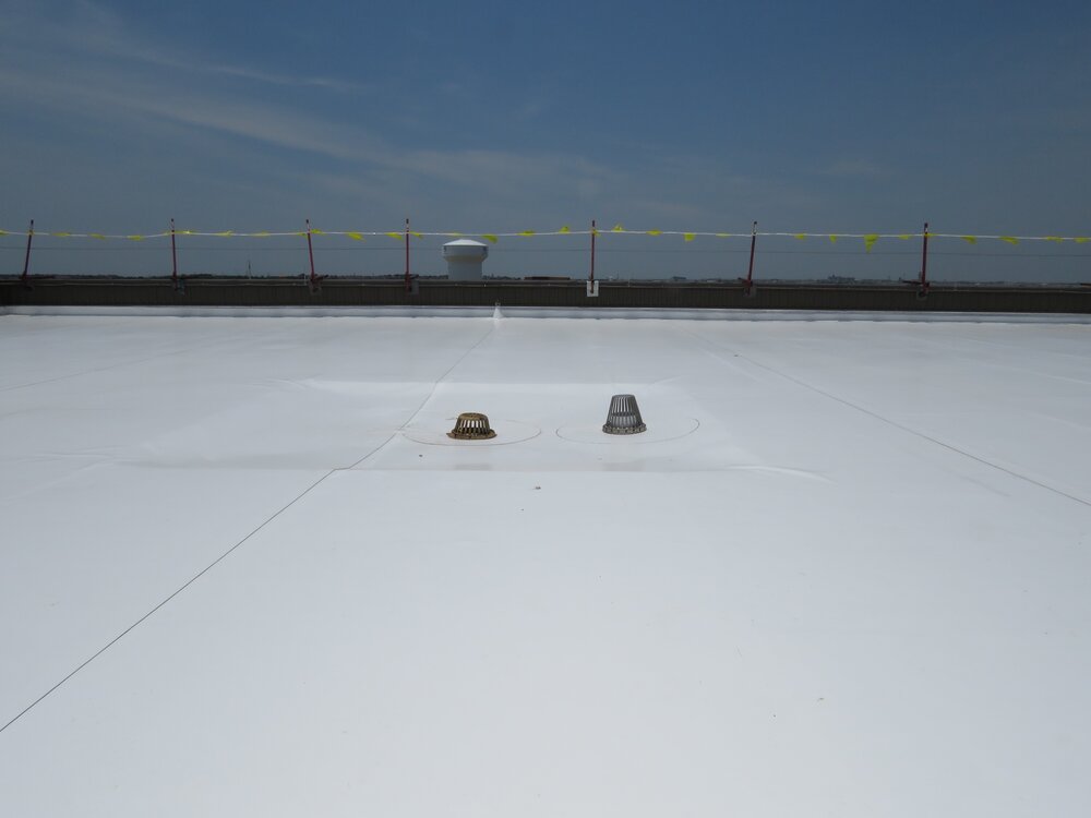 A newly-installed PVC single-ply roof membrane