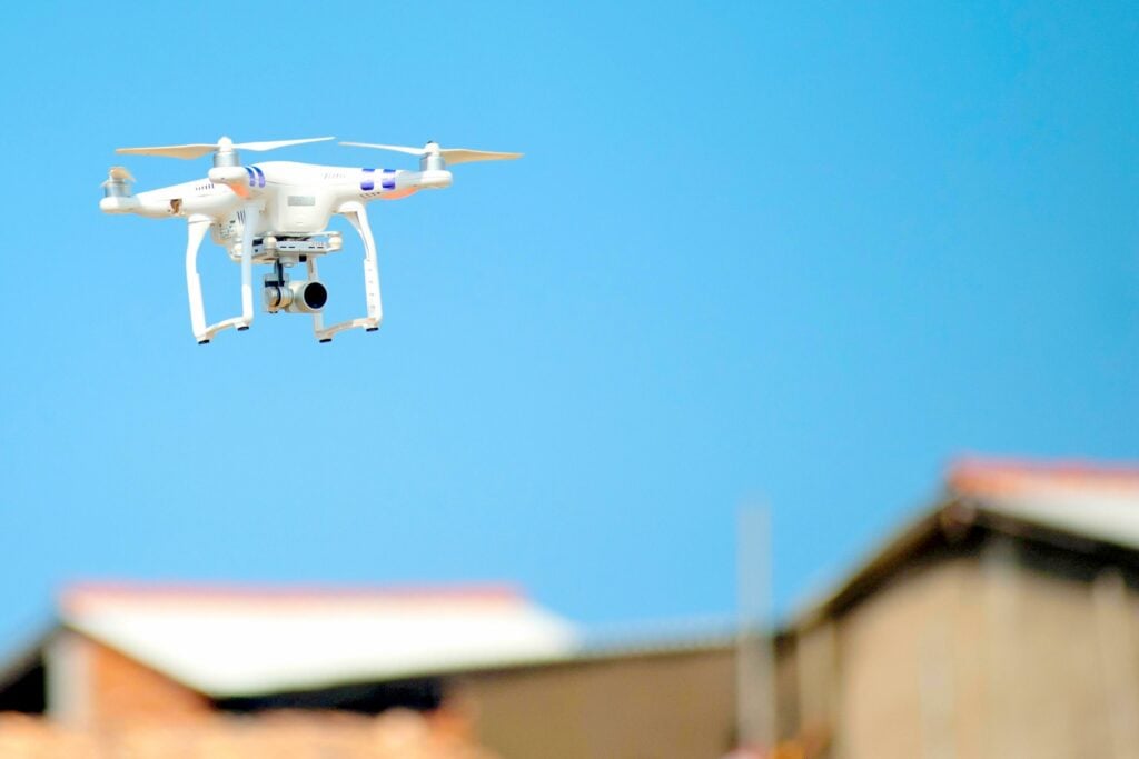 A drone roof inspection drone in flight