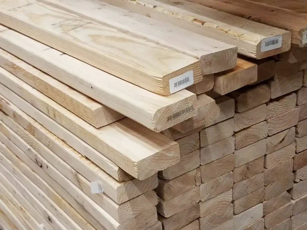 A stack of spruce 2x4 lumber. 2x4 weight per board is a little over 1 pound per foot.