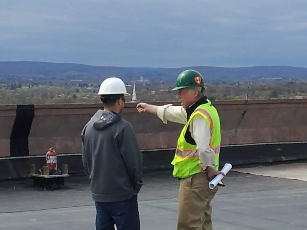 Roof consultants like this one make sure the roofers follow the contract documents.