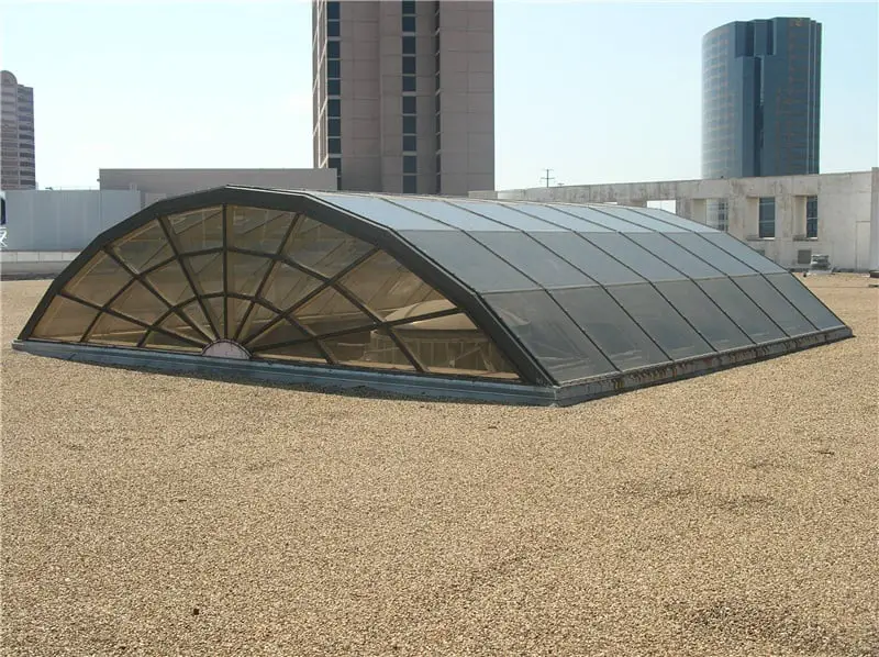 Barrel Vaulted flat end skylight on a built-up roof.