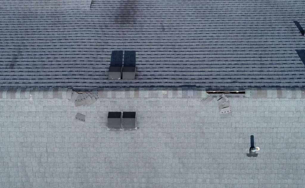 drone image from a drone roof inspection showing storm damage on an asphalt shingle roof