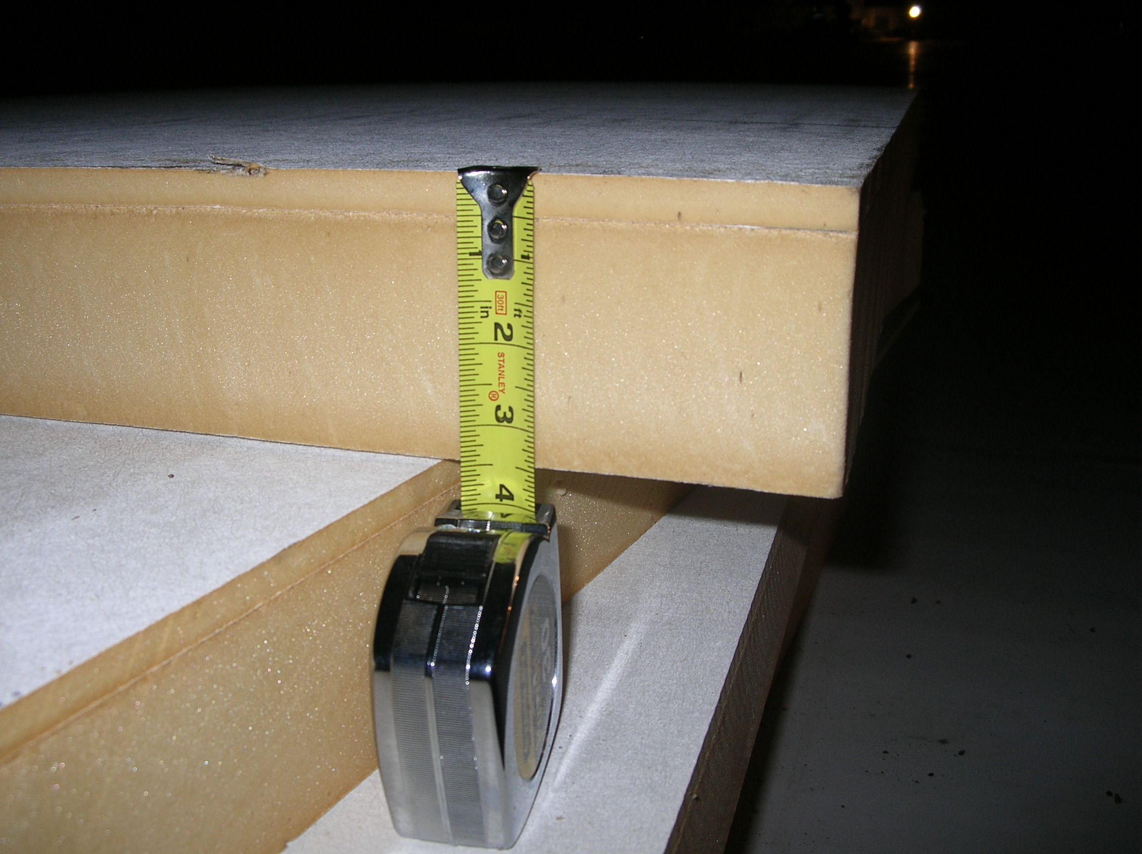 Composite polyiso insulation board. The denser, thinner layer acts as a cover board and is attached at the factory.