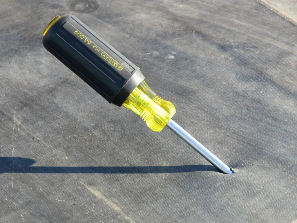dropped screwdriver puncturing an EPDM roof membrane