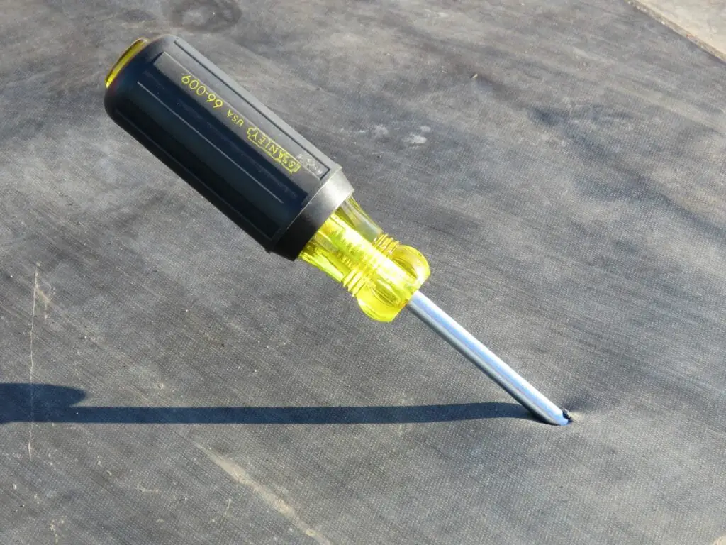 A dropped screwdriver puncturing an EPDM roof membrane.