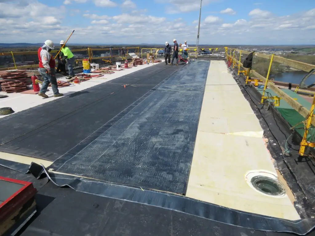 Installing a new fully-adhered EPDM rubber roof. EPDM rubber roof cost here is about $14 per square foot.