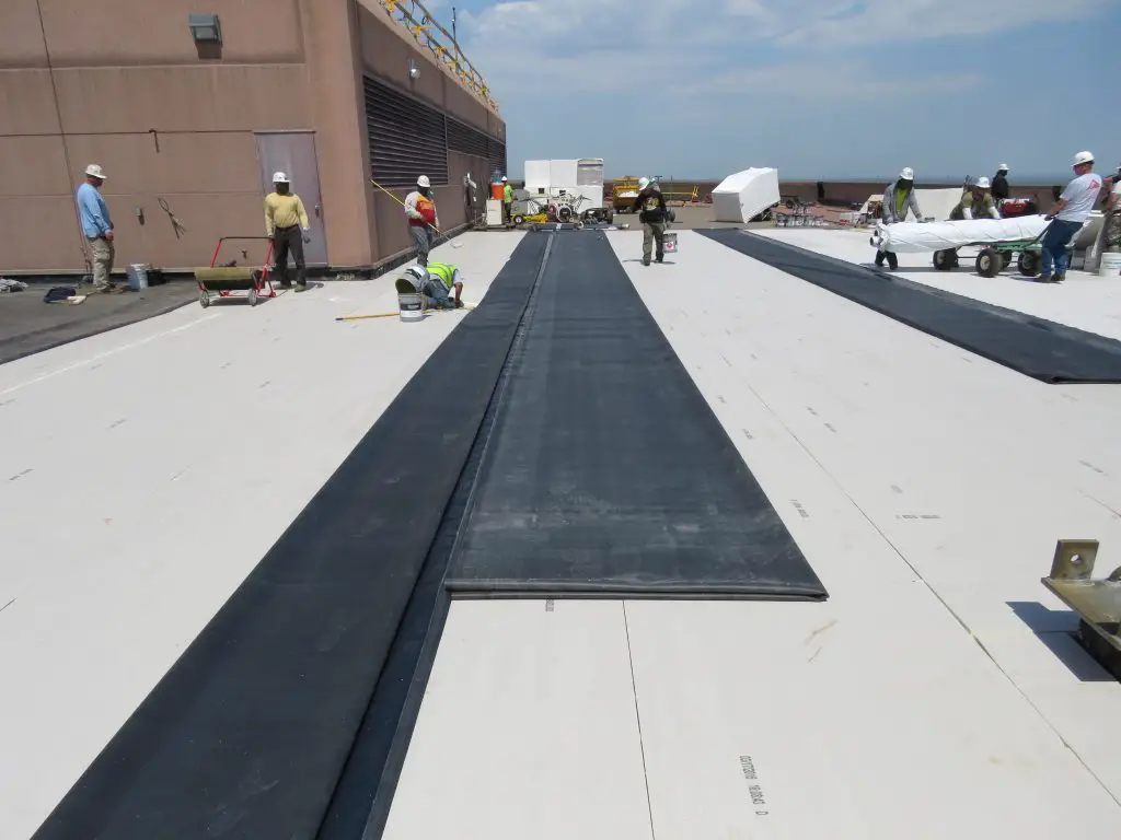 Letting the EPDM roofing sheets relax before installation.