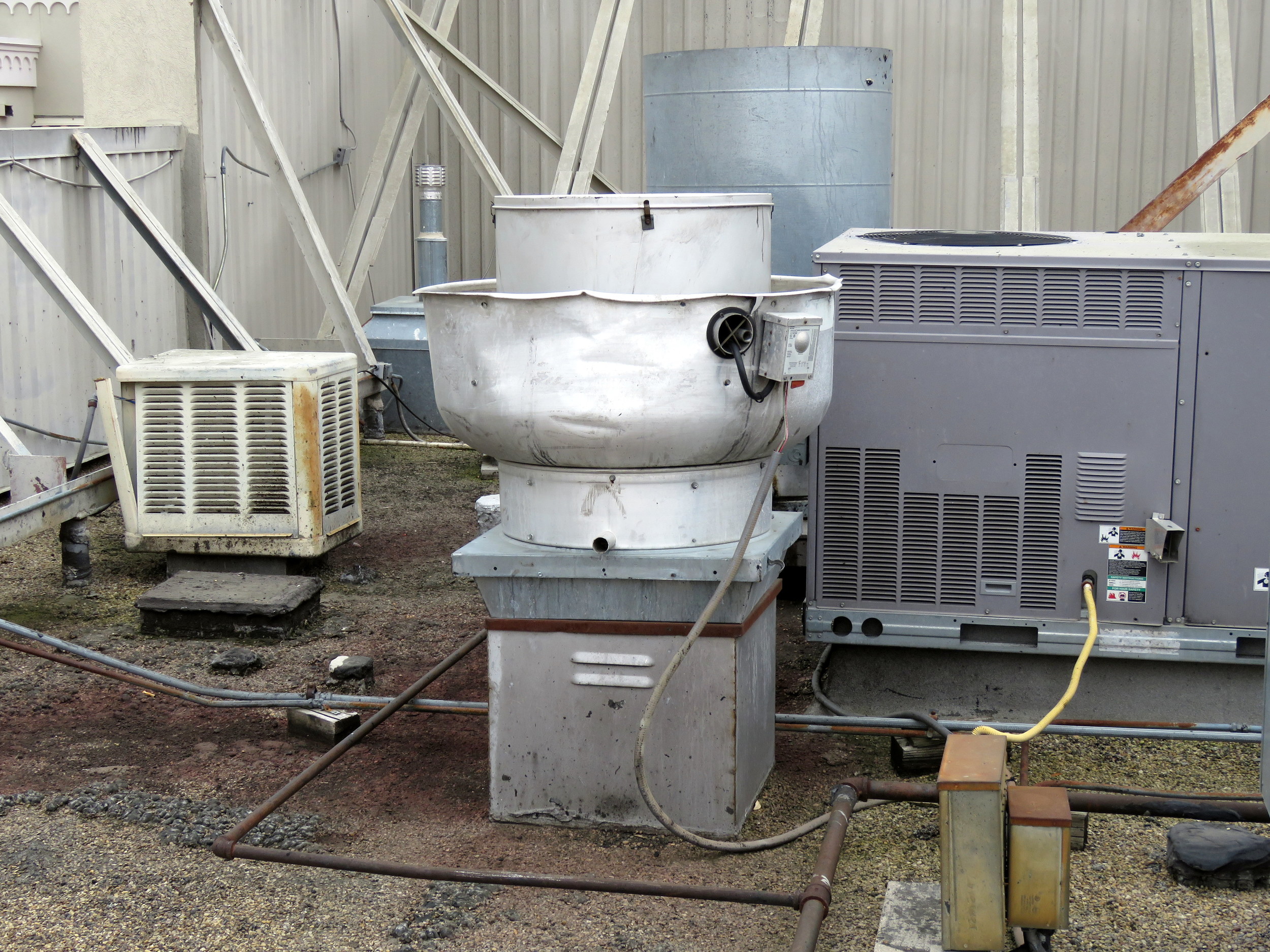 Exhaust fan unit over a restaurant kitchen.