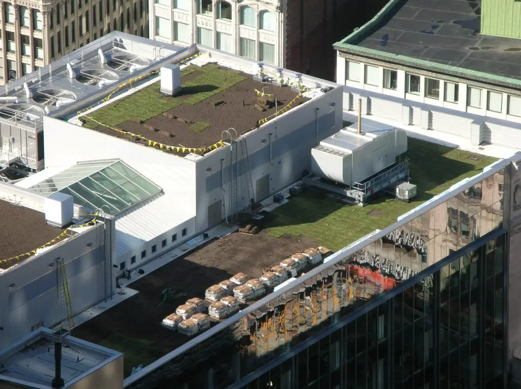 Installing a green roof on a high-rise building.