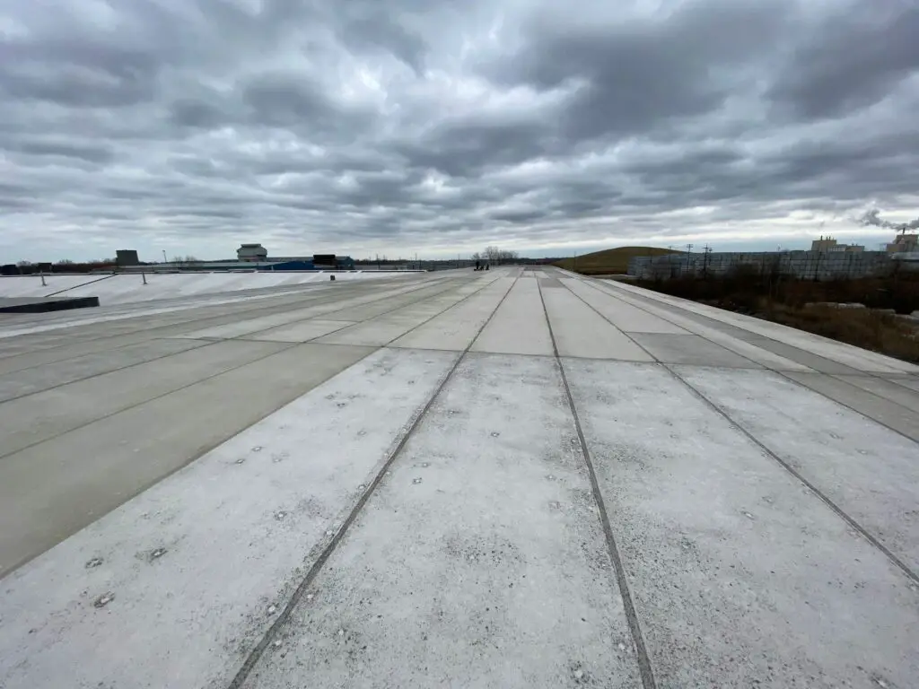 An aged Hypalon single-ply roof membrane.