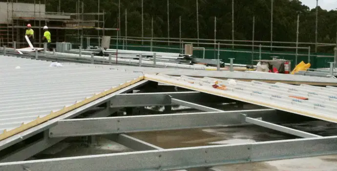 Installing insulated metal roof panels