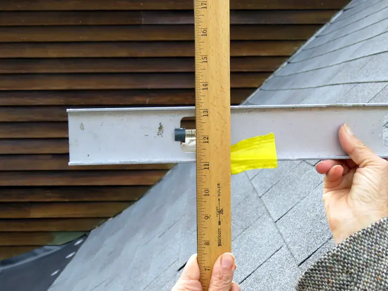 Measuring roof slope with a bubble level and a ruler