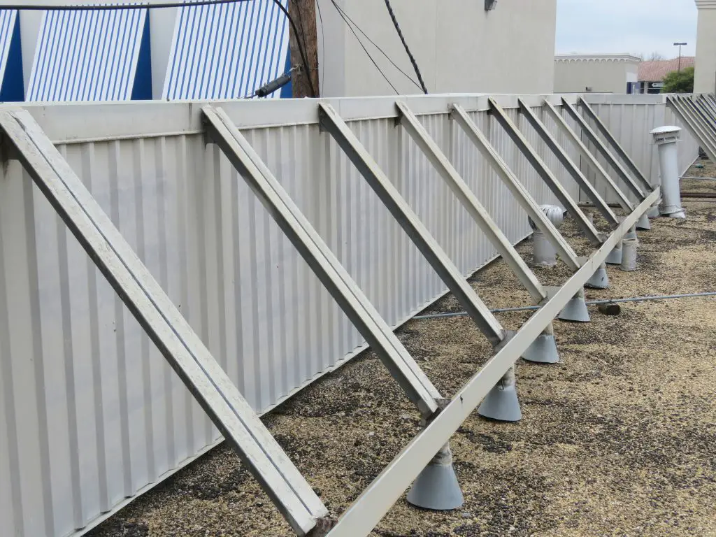 Metal panel wall serving as a rooftop screen wall.