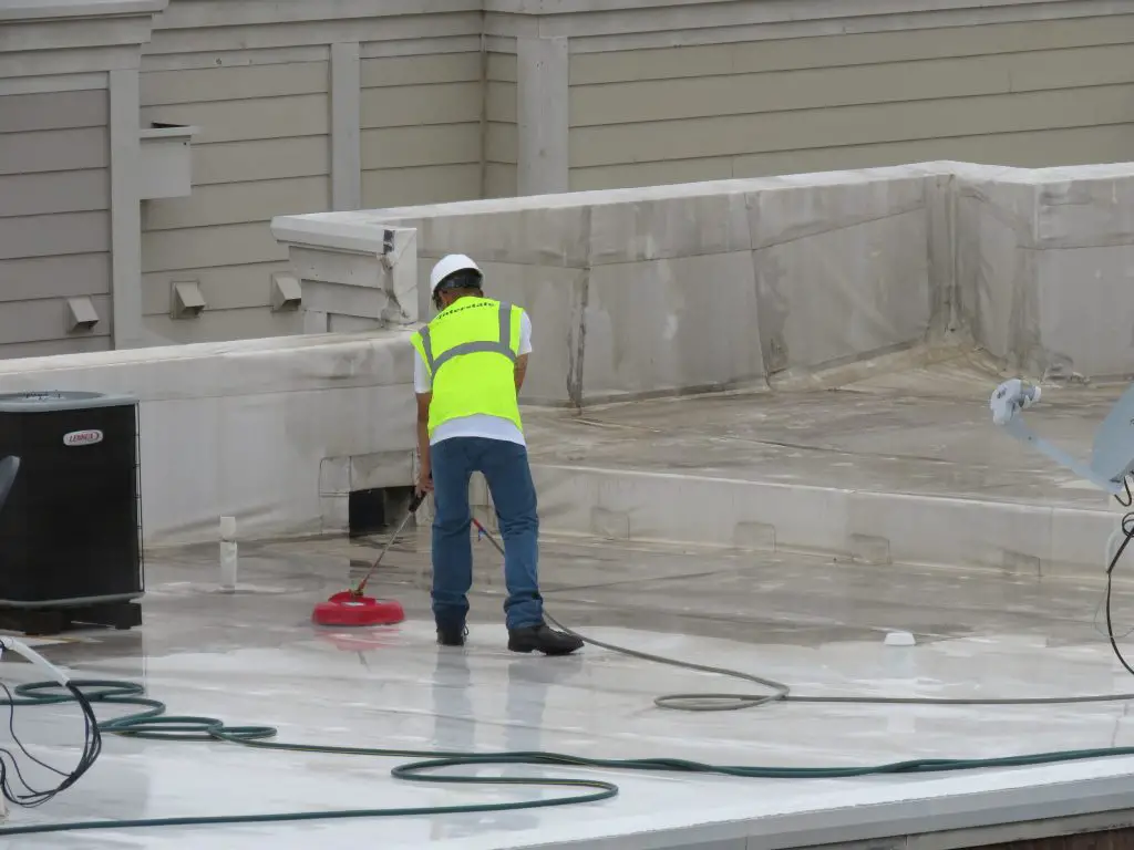 Cleaning a TPO roof after 3 years of dirt build-up.