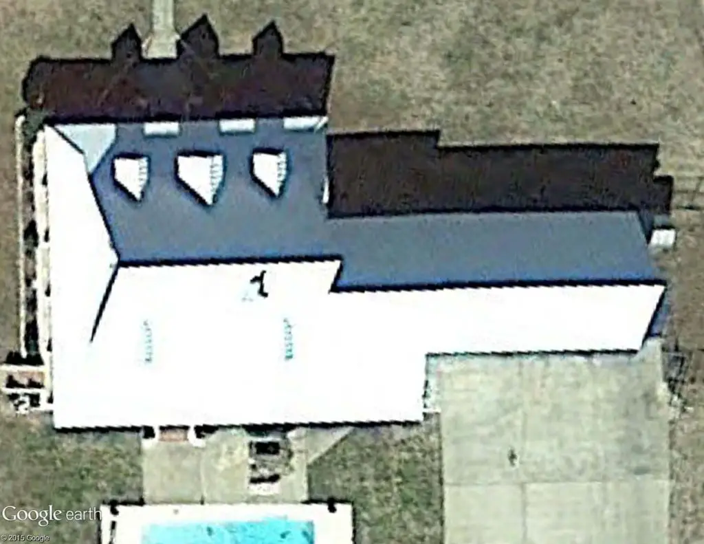 Satellite image of a standing seam metal roof with a reflective coating.