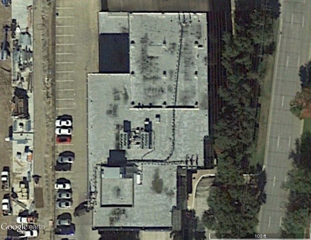 Satellite image of a modified bitumen roof at the end of its service life.