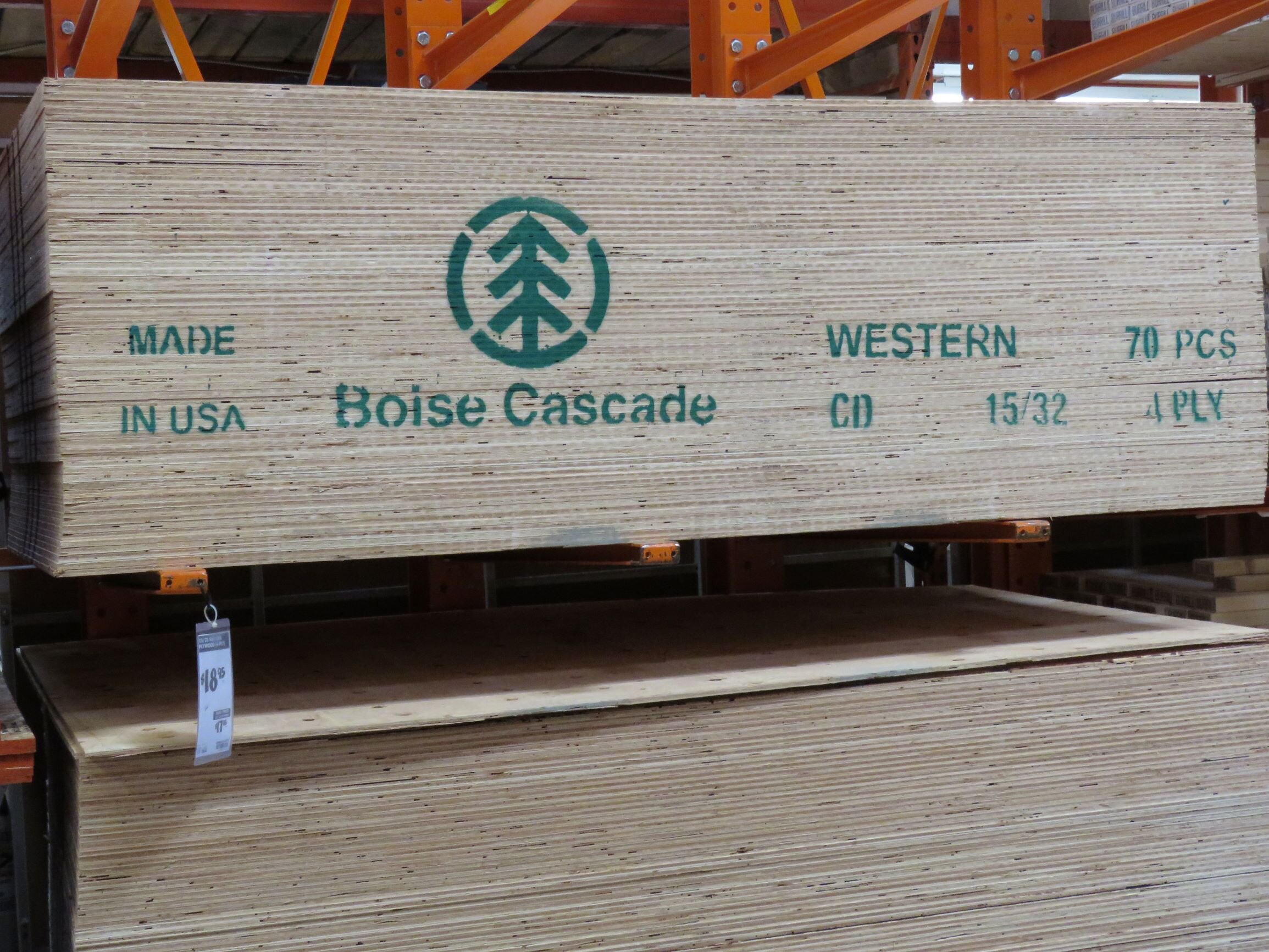 Stacks of 4’ x 8’ softwood plywood panels, 15/32-inch thick. Each sheet weighs about 40 pounds, so each one of those stacks weighs almost a ton and a half.