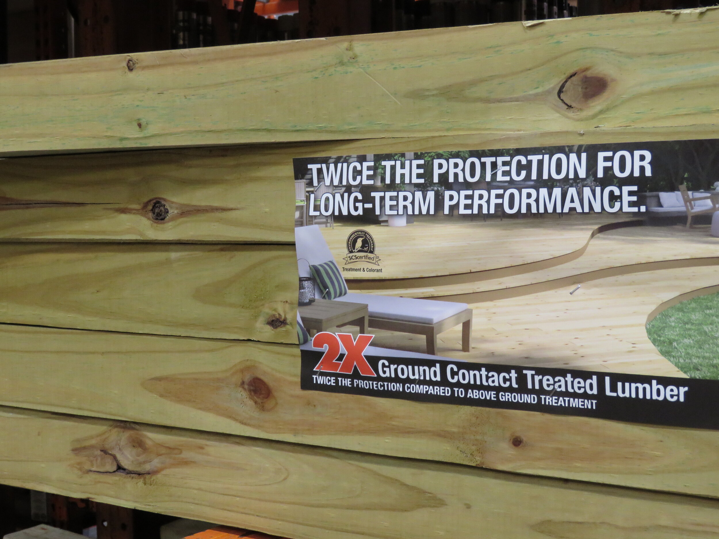 A stack of "Ground Contact" pressure-treated lumber. Other treatment designations relating to end-use applications include "Above Ground", "Foundation", and "Marine".