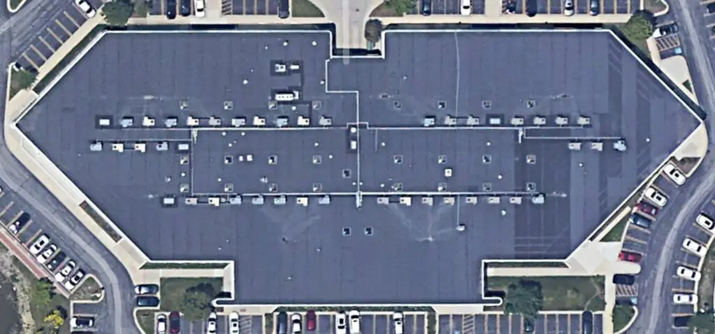 Satellite image of a mechanically-attached EPDM roof with faint lines visible across the roof  where the membrane seams are.