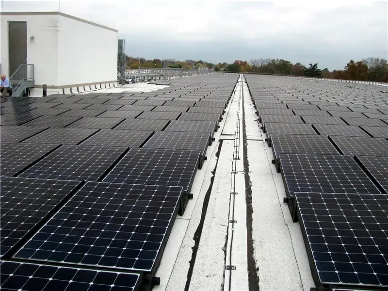 Solar power installation on a commercial low-slope roof.