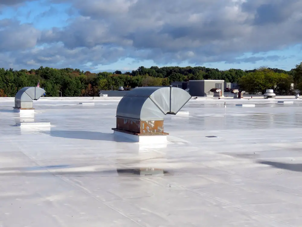 CPE single-ply roof in the morning after it rained.