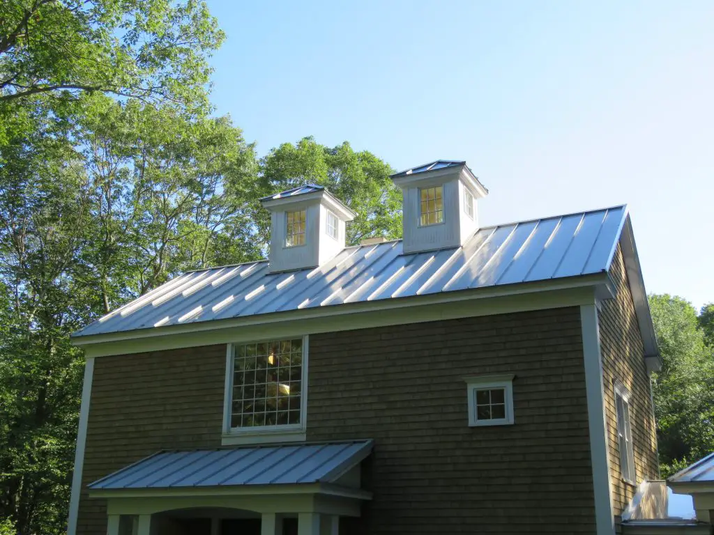 A white standing seam metal roof.
